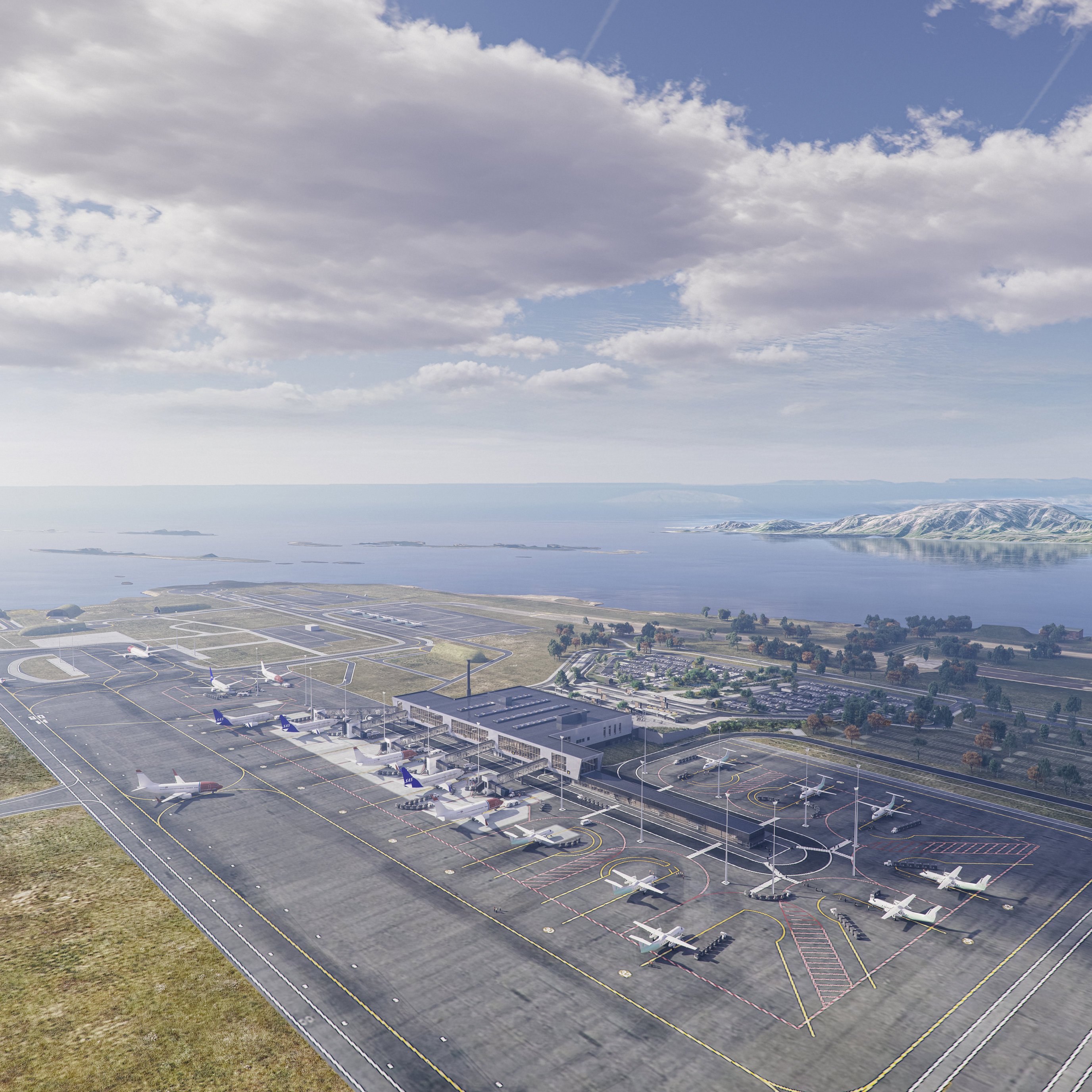 Luftfoto av en moderne flyplass med flere fly på rullebaner og taksebaner, satt mot en bakgrunn av et kystlandskap med fjell og en delvis skyet himmel