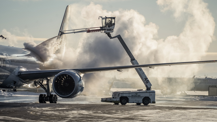 Aircraft are de-iced at the airport in winter.
