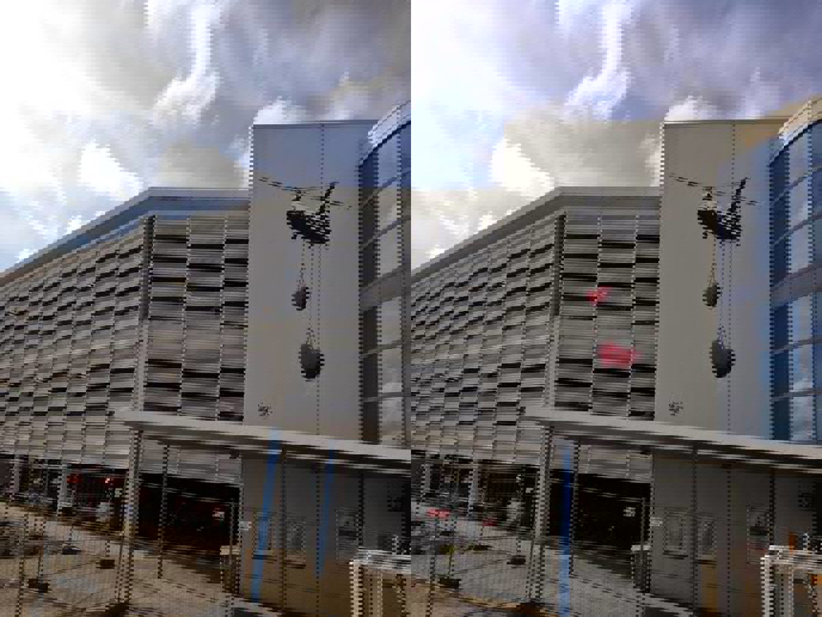 Artwork at Stavanger Airport, painting on the outside of the terminal building. Two red hearts hang from a plane